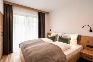 Posteľ alebo postele v izbe v ubytovaní Hohe Tauern Lofts Panoramabahn by Alpina-Holiday