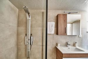 a bathroom with a shower and a sink at Bella Apartment in Kissamos