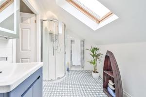 a bathroom with a white sink and a shower at Lisburne Place - Luxury Three Bedroom Town House in Torquay +41 photos
