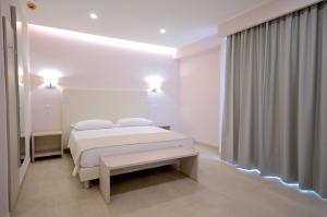 Postel nebo postele na pokoji v ubytování Hotel Residence Il Gabbiano