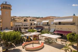 an aerial view of a city with a clock tower at Etoile Luxury Suites in Argostoli