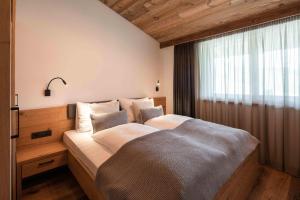 Posteľ alebo postele v izbe v ubytovaní Hohe Tauern Lofts Panoramabahn by Alpina-Holiday