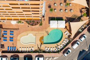 an overhead view of a pool and a building at Prestige Sant Marc in Roses