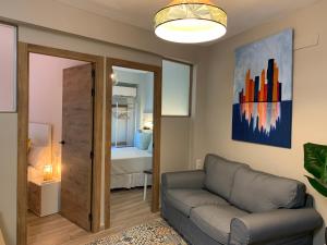 a living room with a couch and a bedroom at Home SEA&DREAMS Beach in Calpe