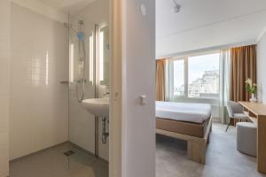 Postel nebo postele na pokoji v ubytování Hotel de Baak Seaside