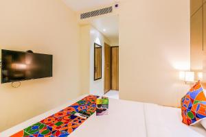 Postel nebo postele na pokoji v ubytování FabHotel RK International - Nr Mumbai International Airport