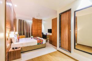 Postel nebo postele na pokoji v ubytování FabHotel RK International - Nr Mumbai International Airport + 17 fotografií