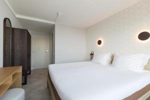 Postel nebo postele na pokoji v ubytování Hotel de Baak Seaside