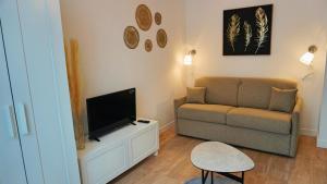Televízia a/alebo spoločenská miestnosť v ubytovaní Proche Carlton & Croisette, Appartement 203