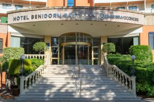 a hotel entrance with stairs in front of a building at Hotel Benidorm East by Pierre & Vacances in Benidorm