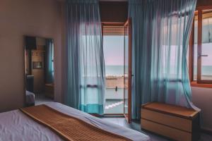 Postel nebo postele na pokoji v ubytování Hotel Monaco & Quisisana