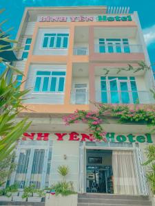 a building with flowers in front of it at Binh Yen Hotel in Ly Son
