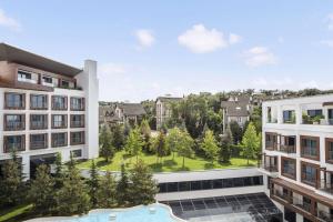 an image of an apartment complex with a swimming pool at Radisson Blu Hotel & Spa, Istanbul Tuzla in Istanbul