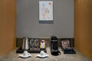 a kitchen counter with a coffee maker and a blender at Radisson Blu Hotel & Spa, Istanbul Tuzla in Istanbul