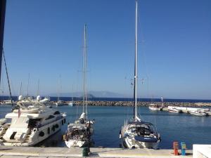 a group of boats docked in a harbor at Marina Square in Páloi