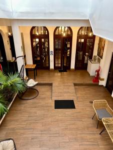 a lobby with tables and chairs in a building at Virreynal by Maysa in Lima