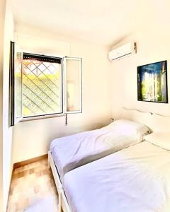 Katil atau katil-katil dalam bilik di Villetta con piscina 300 metri dal mare ‘le dune’