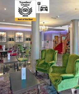 a lobby with green chairs and tables and a chandelier at Brook Lodge Boutique Hotel in Killarney