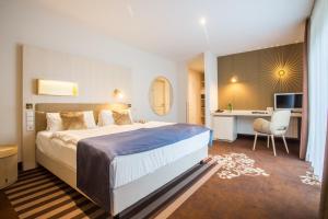 מיטה או מיטות בחדר ב-Residenz Hotel Zum Zollhaus