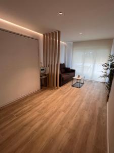 a living room with a couch and a table at Cap Salou Apolo in Salou