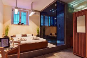Łóżko lub łóżka w pokoju w obiekcie Hotel Villa Eugenia