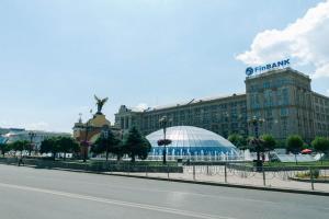 a large building with a building with a dome on it at Maidan, Khreschatyk 3BR in Kyiv