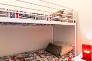 a small bedroom with a bunk bed with a pillow on the bottom shelf at La Dimora della Luna in Pozzallo