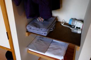 a counter in a room with a paper on it at Guesthouse Sakuya in Fujikawaguchiko +29 photos