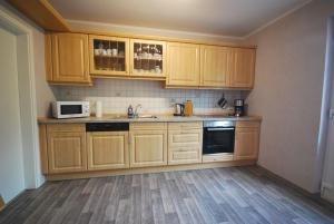 Kuchyň nebo kuchyňský kout v ubytování Ferienwohnung Up Hobarg 35523