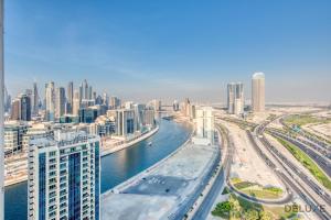 a view of a city with a river and buildings at Classy 1BR at Bayz by Danube Business Bay by Deluxe Holiday Homes in Dubai