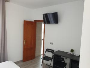 TV a/nebo společenská místnost v ubytování Habitación Aponiente