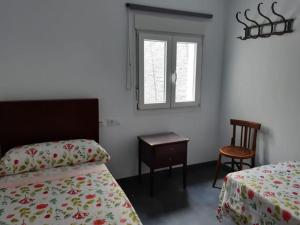 เตียงในห้องที่ Casa llena de vida con patio y terraza