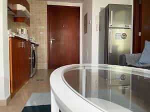 a kitchen with a bath tub in a room at Near Metro - Lovely Modern 1 Bedroom in JLT in Dubai