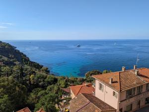 a view of the ocean from a house at Appartement Villa Belle Epoque Roquebrune Cap Martin in Roquebrune-Cap-Martin