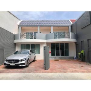 a silver car parked in front of a house at Cha-am Beach Vacation Home in Cha Am