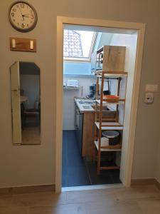 A kitchen or kitchenette at Silver Zsóry Apartman