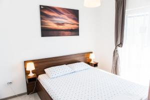 Tempat tidur dalam kamar di Apartment Adriatic Blue