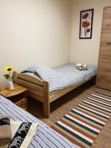 A bed or beds in a room at Silver Zsóry Apartman