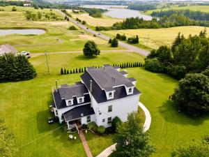 an aerial view of a house on a green field at The New Glasgow Inn in New Glasgow