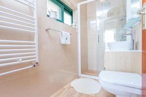 a bathroom with a toilet and a shower and a sink at Studio Makarska 11063b in Makarska +22 photos