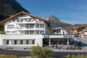 a hotel with motorcycles parked in front of a building at Hotel Luggi in Galtür