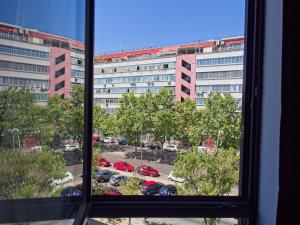 a view from a window of a parking lot at DWO Colours Alcalá in Madrid