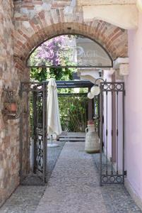 an entrance to a building with an open gate at Hotel Pace in Sirmione