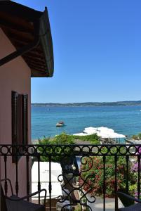 a balcony with a view of the ocean at Hotel Pace in Sirmione