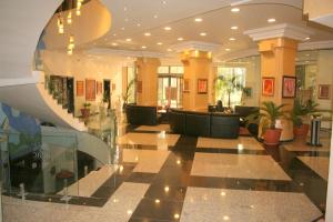 a lobby with couches and tables in a building at Aparthotel VRIS in Tsarevo
