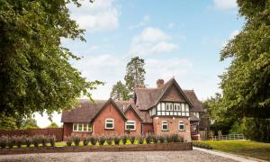 a house with a gambrel roof at Brockencote Hall in Kidderminster