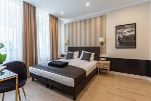 Posteľ alebo postele v izbe v ubytovaní AR Apartamenty