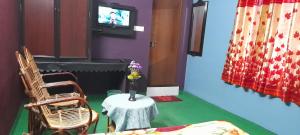 TV a/nebo společenská místnost v ubytování Le Farmhouse Munnar