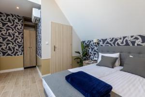 Posteľ alebo postele v izbe v ubytovaní AR Apartamenty