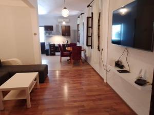 a living room with a couch and a table at Apartman Plava riba in Šibenik